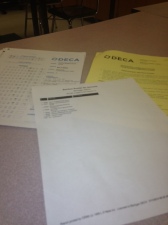 As a judge at the DECA District 7 Competition, I had a set of instructions with a role-playing scenario, Scantron to record my vote and list of students who would be presenting. 